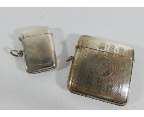 A 1920's silver engine turned Vesta case and a small plain rectangular Vesta case 