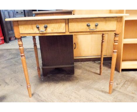 A 1920's light oak hall table fitted two drawers standing on turned legs 3' wide 