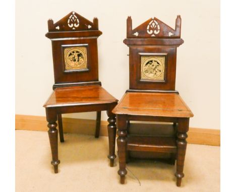 A pair of Victorian mahogany hall or library chairs one converts to a pair of library steps with inset Minton tile backs 
