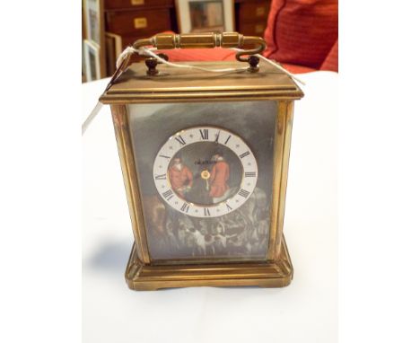 A quartz brass cased carriage clock with fox hunting scene
