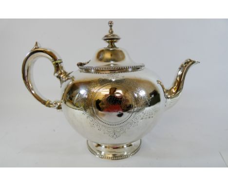A Victorian silver melon shaped teapot standing on a circular beaded foot, retailed by the Goldsmith Alliance Cornhill, Londo
