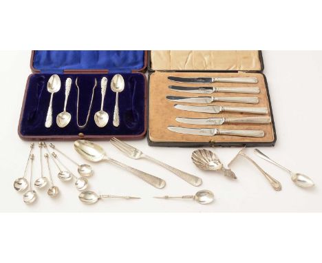 A selection of silver teaspoons, one part set with tongs in case; silver mounted handled tea knives, cased; a silver fork and