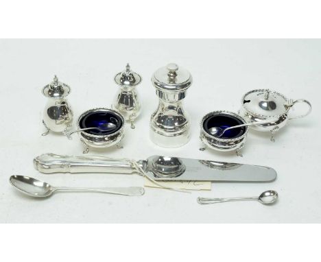 A silver condiment set, by Josiah Williams &amp; Co, London 1918, comprising two open salt cellars; mustard pot and a pair of