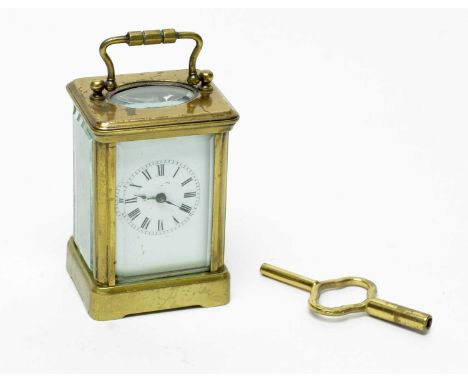 A 19th Century French brass cased carriage clock, white enamel Roman dial, with platform lever escapement, 10cms high includi