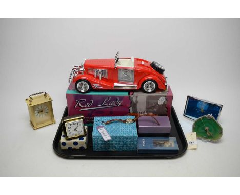 A selection of novelty timepieces, including: Red Lady Forties Car alarm clock, with box; German Santima Quartz mantel clock;