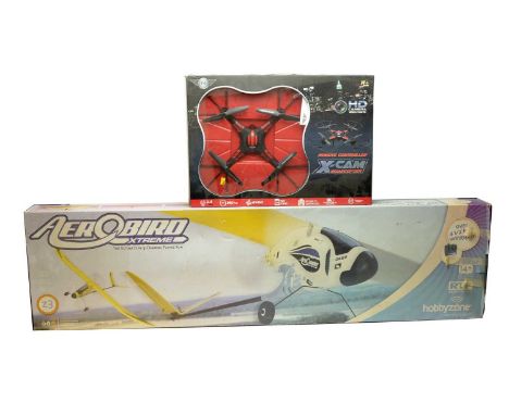 A remote-controlled X-Cam Quadcopter, by Flying Gadgets, with HD video/photo camera, in box; and an AeroBird Xtreme 3-Channel