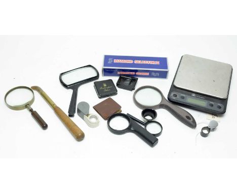 A collection of magnifying lenses and other tools, including: Culti diamond selector, in box; five hand held magnifying glass