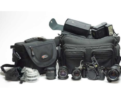 A Canon A1 camera, complete with three Canon Lenses, comprising: FD 28-55 Macro; FD 70-210 Macro; FD 50mm 1.8; together with 