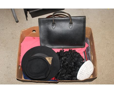 A box containing vintage ladies dresses, hats and handbags