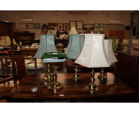 Two pairs of brass table lamps and shades, together with a desk lamp with green glass shade