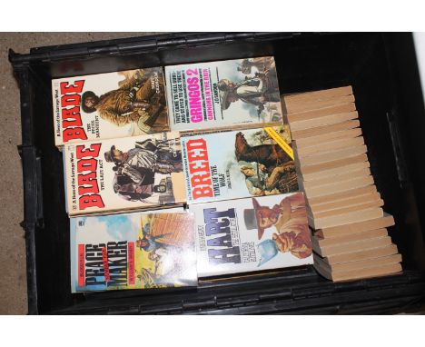 A crate of Western vintage paperback books