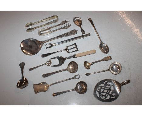 A box containing various silver plated cutlery to include sifter spoons, caddy spoon, sugar tongs etc.