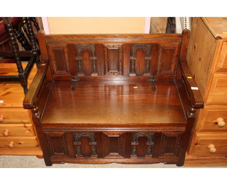 An oak bench with a lift up storage