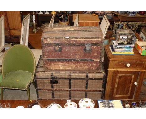 A wood and metal bound dome topped canvas trunk together with a wood and metal canvas trunk larger, AF