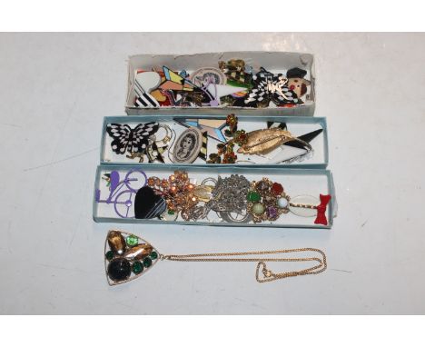 Three boxes containing vintage and other costume brooches