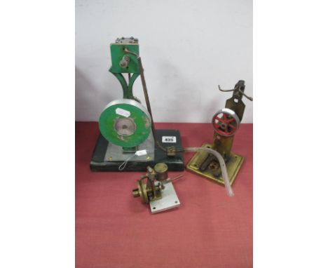 A Home Engineered Live Vertical Steam Engine, 2.5cm stroke, 9.5cm diameter flywheel, finished in green, black and bright meta
