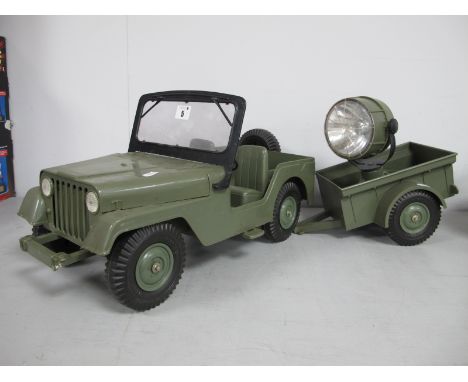 A Vintage Action Man Marx Jeep and Searchlight Trailer, damage to steering wheel, trailer hitch, front bumper missing spare w