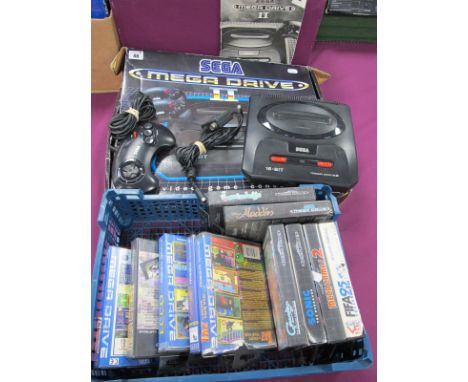A Boxed Sega Mega Drive II, 16 Bit Video Console, (untested) one control pad, eleven games cartridges, including Sonic The He
