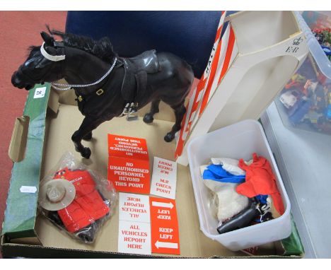 A Vintage Palitoy Action Man Black Horse, with saddle and tack, The Royal Canadian mounted police uniform, clothing accessori