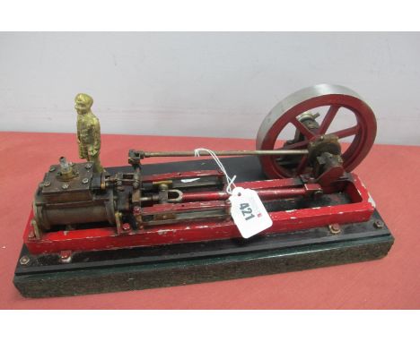 A Horizontal Single Cylinder Steam Engine, two inch stroke, five inch diameter flywheel, finished overall red and bright meta