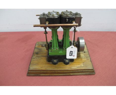 A Stuart Turner D10 Twin Cylinder Vertical Steam Engine, mounted to a wood base, overall dimension 9 x 6 x 7inch, very good.
