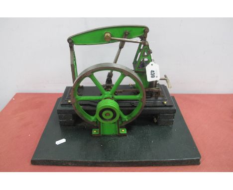 A Stuart Live Steam Beam Engine, seven inch flywheel, mounted to a 10 x 15 inch wood base, height eleven inch, finished overa