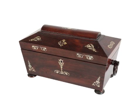 A VICTORIAN ROSEWOOD AND MOTHER OF PEARL TEA CADDY circa 1875, of sarcophagus form, the interior with a cut glass bowl, flank