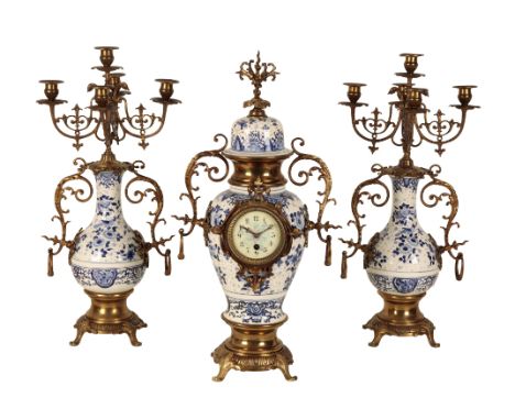 A 20TH CENTURY FRENCH PORCELAINE AND GILT METAL CLOCK GARNITURE the 9cm painted clock dial, with Arabic numerals, mounted in 