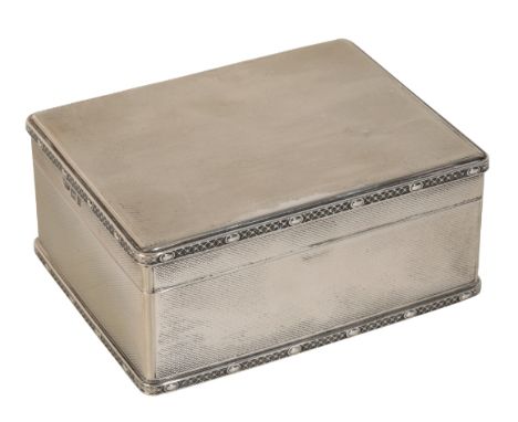 A SILVER CIGARETTE BOX by Asprey &amp; Co. Ltd, London, 1928, of rectangular form with engine turned decoration, the gilt int