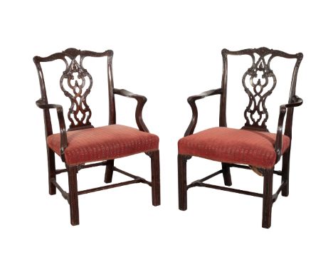 A PAIR OF GEORGE II STYLE MAHOGANY ARMCHAIRS IN THE MANNER OF THOMAS CHIPPENDALE 19th century, the shaped cresting rails over