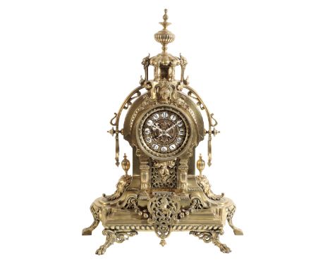 A FRENCH BRASS CASED MANTLE CLOCK the 12cm dial with porcelain tablet Roman numerals, the two train movement striking on a be