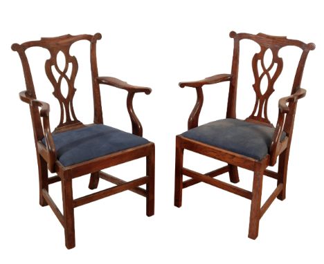 A PAIR OF COUNTRY CHIPPENDALE STYLE ELBOW CHAIRS 19th century, the shaped cresting rail over a pierced back-splat, with drop-