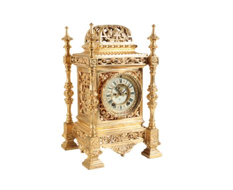 A GILT BRASS CASED MANTEL CLOCK the sunken porcelain dial with visual escapement, two train "American" movement striking on a