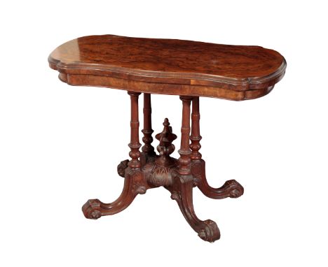 A VICTORIAN BURR WALNUT CARD TABLE the shaped top opening to reveal a green baize-lined interior, on a turned quatreform base