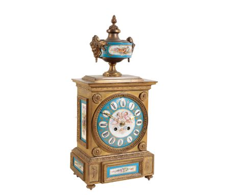 A FRENCH BRASS CASED MANTLE CLOCK WITH SEVRES STYLE PORCELAIN PANELS the 14cm porcelain dial with Roman numerals, the two tra