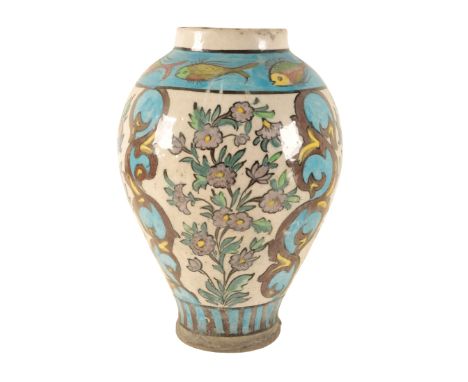 AN IZNIK STYLE CERAMIC VASE of baluster form, 31cm high