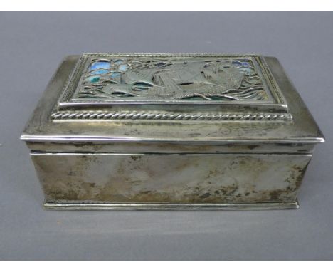Omar Ramsden - Heavy rectangular silver box with openwork Galleon decoration having blue green enamel to top, rope border.  L