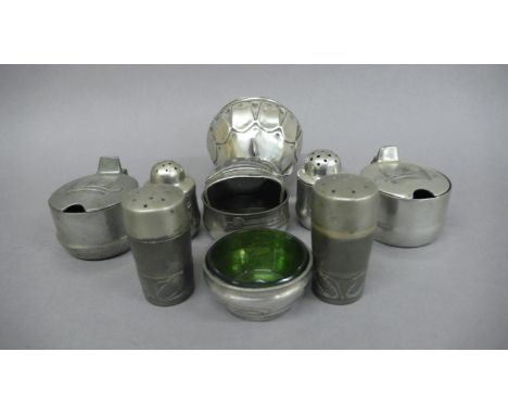 Archibald Knox for Liberty &amp; Co Tudric Pewter salts, peppers and mustards and a napkin ring Nos 0347, 0349, 0265 &amp; 09