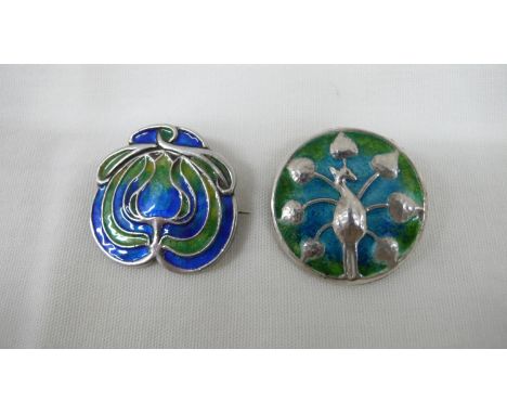 Two Liberty &amp; Co Cymric silver and enamel brooches 1) Peacock and 2) Tulip circa 1903/1904 
