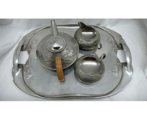 Archibald Knox for Liberty &amp; Co. English Pewter. Three piece tea service plus tray with foliate decoration, No. 0231 