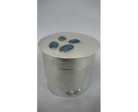 Liberty &amp; Co Pewter cylindrical jar with cover having four oval enamel buttons to top and lozenge decoration to border at
