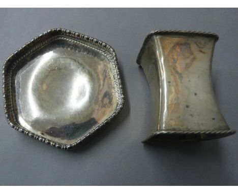 Omar Ramsden 1) Hexagonal small dish with cotton reel decoration to border.  London 1931 and 2) Square concave silver napkin 