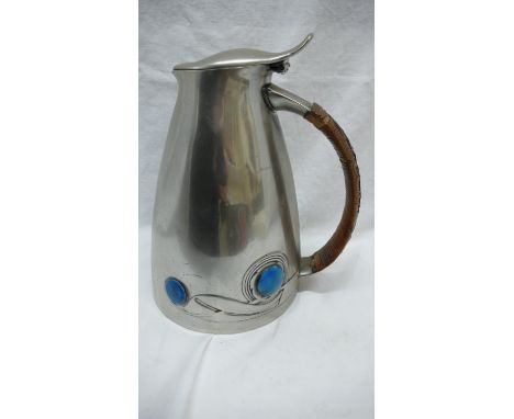 Archibald Knox for Liberty &amp; Co. pewter hot water jug with swelling conical body, cane handle and blue enamel button deco