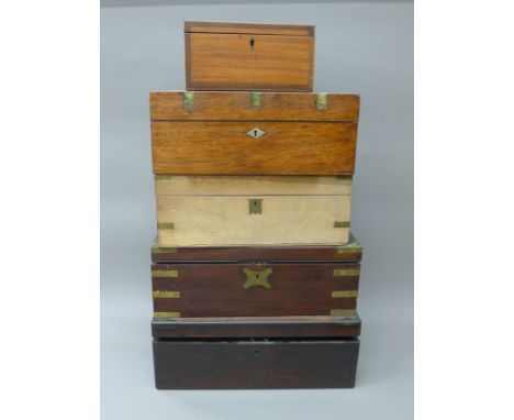 A quantity of 19th century writing slopes and a tea caddy. The largest 45.5 cm wide.