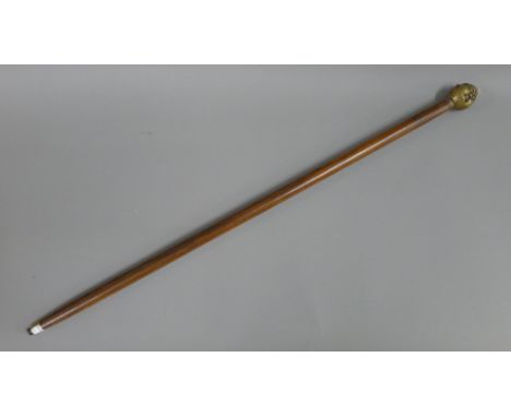 A four faced buddha handled walking stick. 92 cm long.