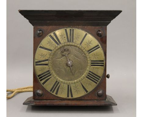 A 19th century oak cased hanging clock. 29 cm high.