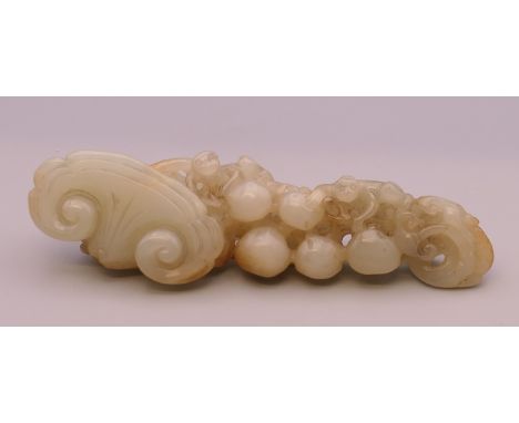 A jade ruyi sceptre. 15.5 cm long.