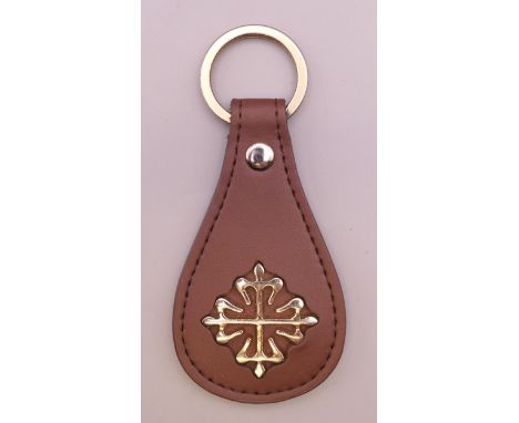 A Patek Philippe key ring. 10 cm long.