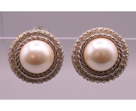 A pair of Christian Dior clip earrings.  2.5 cm diameter.
