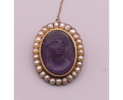 A 19th century seed pearl mounted carved hardstone cameo brooch. 3 cm high.
